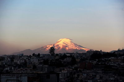 View of volcanic mountain against sky during sunset