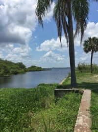 Scenic view of lake against cloudy sky