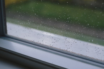 Wet glass window in rainy season
