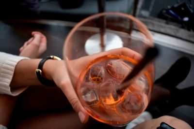 Close-up of woman hand holding glass