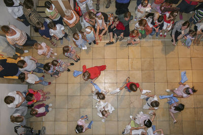 High angle view of people on tiled floor