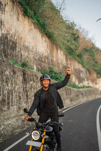 Man riding bicycle on road