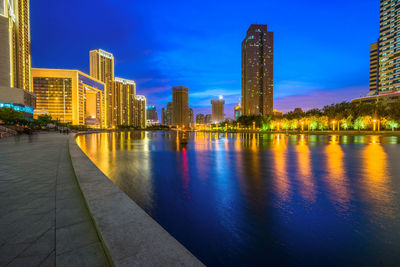 Reflection of buildings in city at night