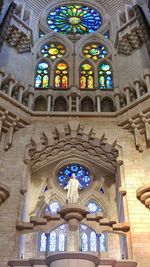 Low angle view of stained glass window in temple