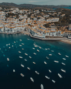 High angle view of townscape by sea