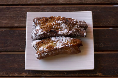 Biscuit dessert with powdered icing sugar