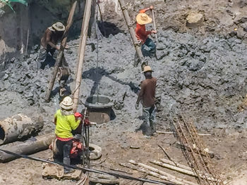 High angle view of men on rock