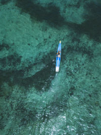 Young woman on stand up paddling board