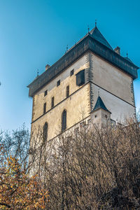 Low angle view of building against clear blue sky