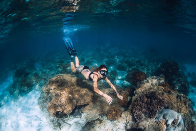 Young woman swimming in sea