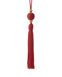 Red bell hanging against white background