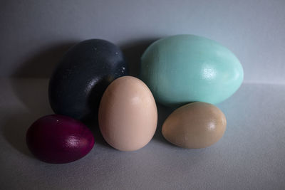 Close-up of multi colored eggs on table