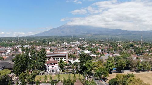 Aerial view of townscape against sky