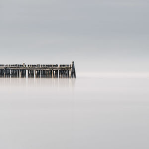 Scenic view of sea against misty day
