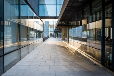 Road amidst modern buildings