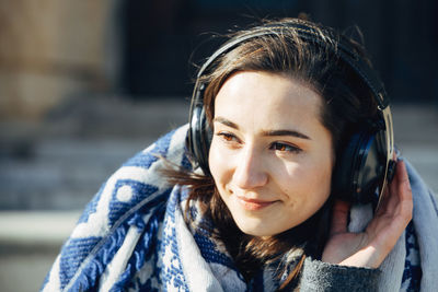 Close-up portrait of a smiling young woman