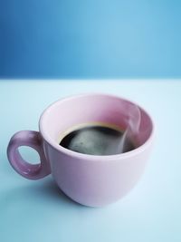 Close-up of coffee cup on table