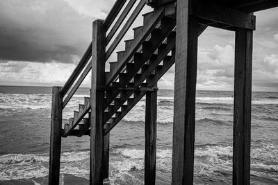 Pier over sea against sky