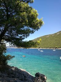 Scenic view of sea against clear blue sky