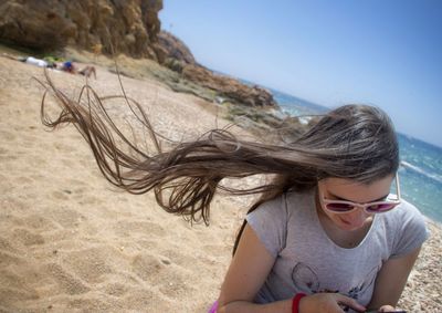 Portrait of woman standing on beach