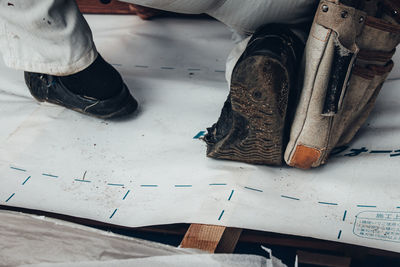 Low section of person working on floor