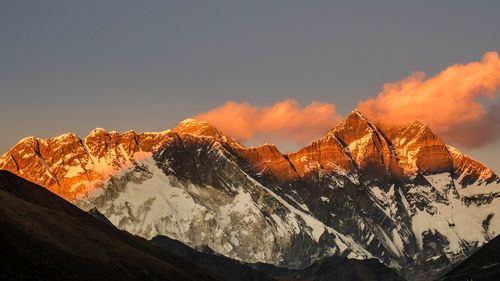 Scenic view of snowcapped mountains against sky during winter