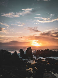 Scenic view of sea against sky during sunset