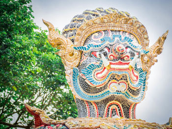 Low angle view of statue against sky