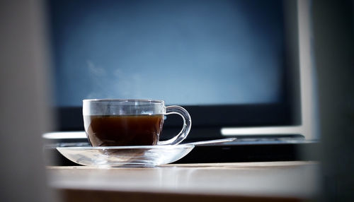 Close-up of coffee in cup on table