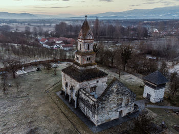 High angle view of historic building against sky at dusk