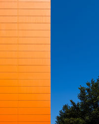 Low angle view of building against blue sky