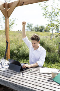 Side view of man using mobile phone