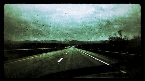 Road seen through car windshield