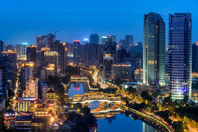 Illuminated buildings in city at night