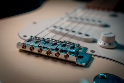 Close-up of guitar on table