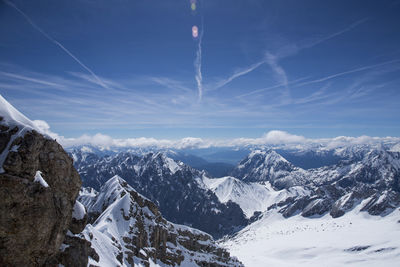 Scenic view of snowcapped mountains against sky