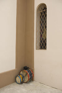 Percussion instruments in the corner of a church wall