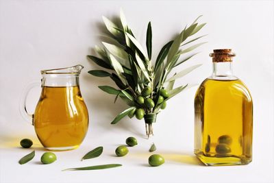 Close-up of yellow glass bottle on table