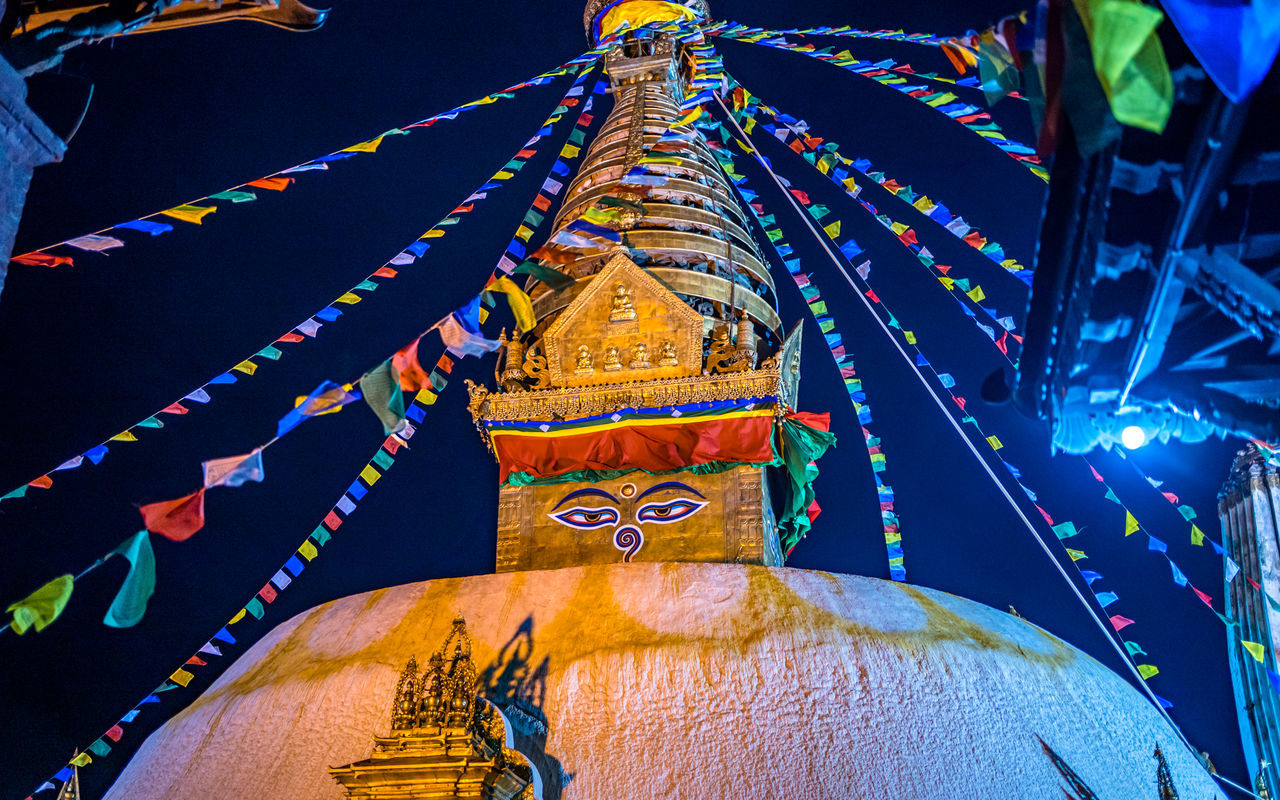 religion, architecture, belief, temple - building, multi colored, decoration, spirituality, tradition, travel destinations, built structure, no people, night, event, building, place of worship, celebration, illuminated, travel, outdoors, history, nature, low angle view