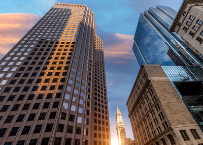 Low angle view of modern buildings against sky in city