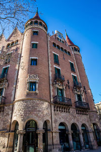 Low angle view of building against blue sky