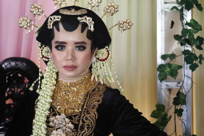 Portrait of young woman wearing traditional clothing