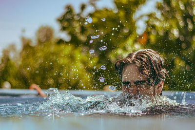 Close-up of water splashing in lake