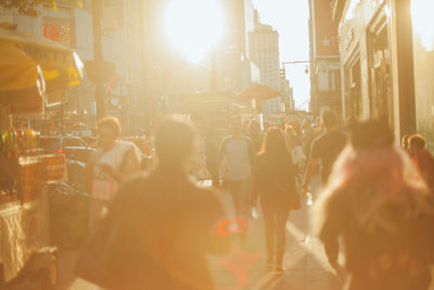 People in city during sunset