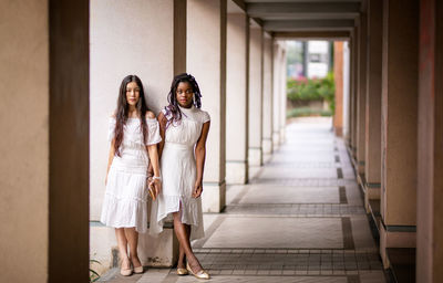 Portrait of woman standing in corridor