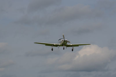 Low angle view of airplane flying in sky