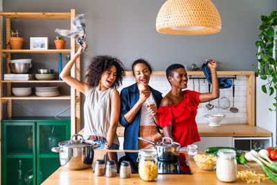 Portrait of smiling friends working at home