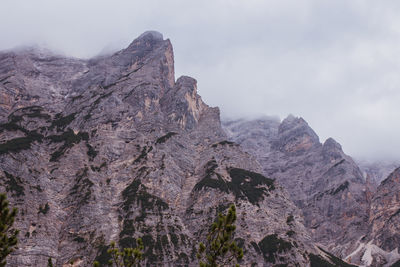 Low angle view of rock formation against sky