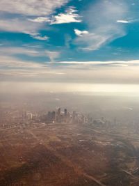 Aerial view of cityscape against sky