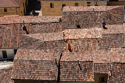 Background of old village houses with stone walls and red tile roofs. frias, burgos